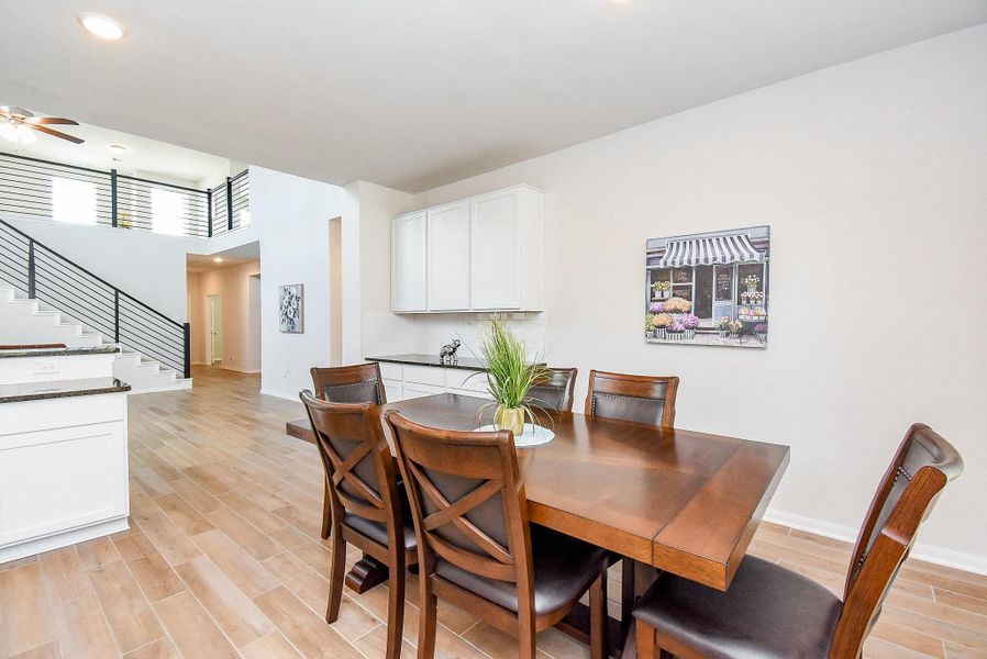 Enjoy a relaxing meal or casual conversation at the open dining area. Enjoy a relaxing meal or casual conversation at the open dining area.