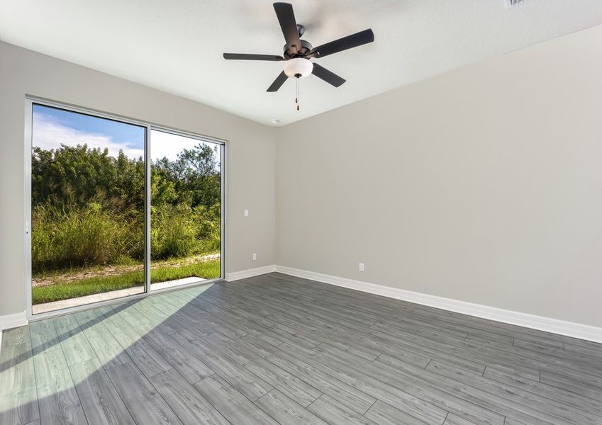 The family room has a sliding glass door that leads out into the backyard