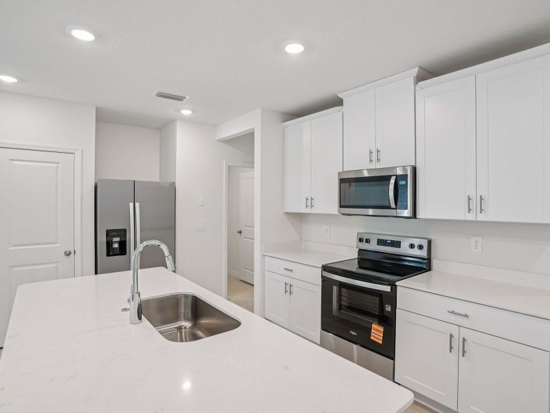 Furnished interior view inside a new home in The Meadow at Crossprairie Townes, St. Cloud (Image 4).