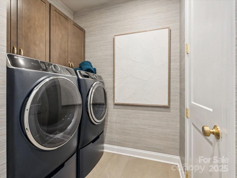 Large Laundry Room With Tile Floor. *Model Photos | Actual Finishes, Structural Selections, and Orientation May Vary. Large Laundry Room With Tile Floor. *Model Photos | Actual Finishes, Structural Selections, and Orientation May Vary.