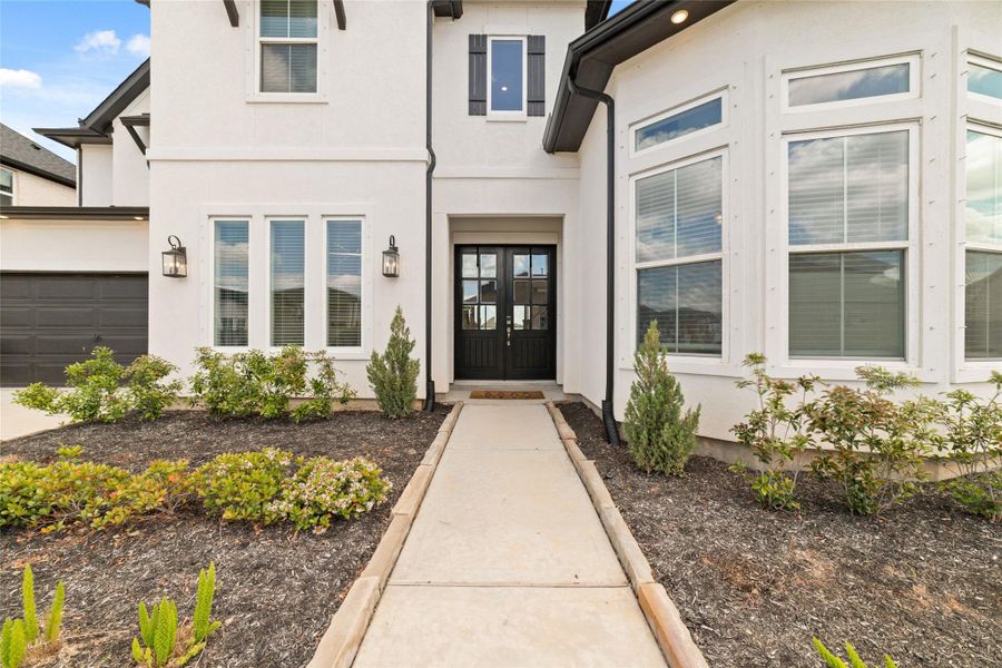 Exterior details and patio area of a home in Pomona 70' - Section 27, Manvel (Image 3).