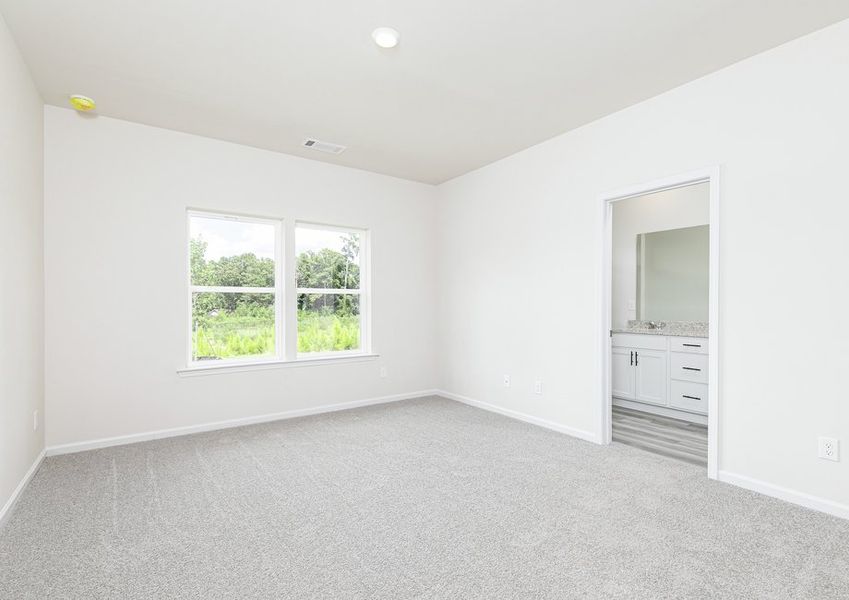 Unwind in the master bedroom after a long day at work