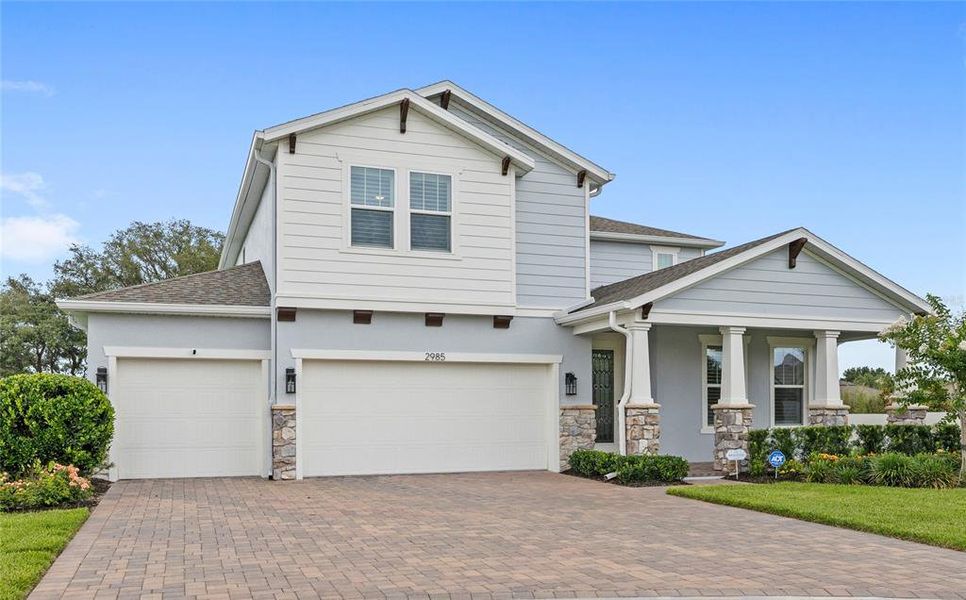 Front exterior of a new home in Acuera Estates, Apopka, FL, highlighting curb appeal (Image 1). Front exterior of a new home in Acuera Estates, Apopka, FL, highlighting curb appeal (Image 1).