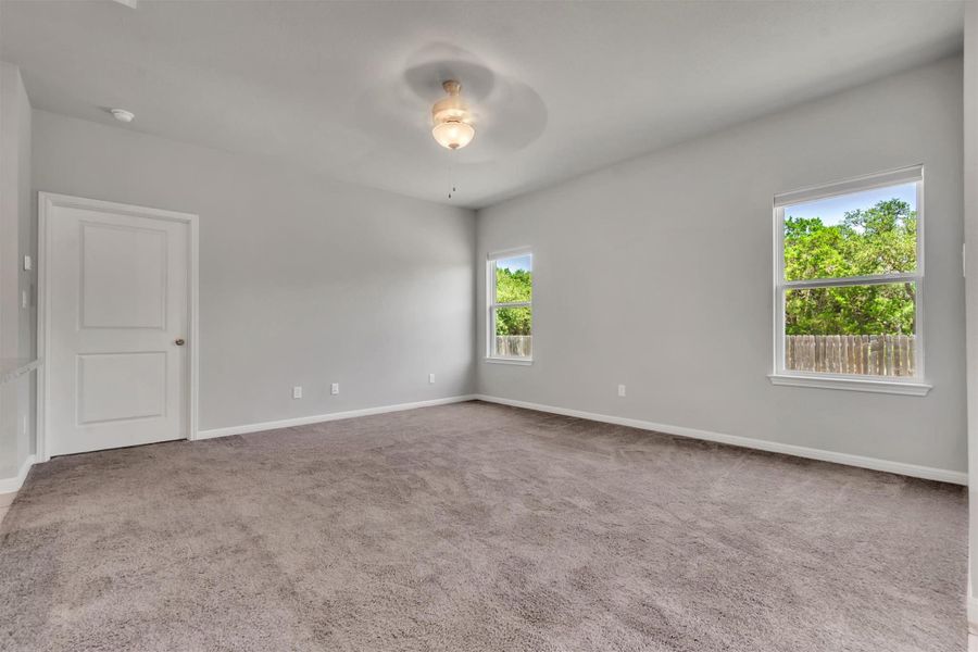 A quiet bedroom retreat with abundant natural light.