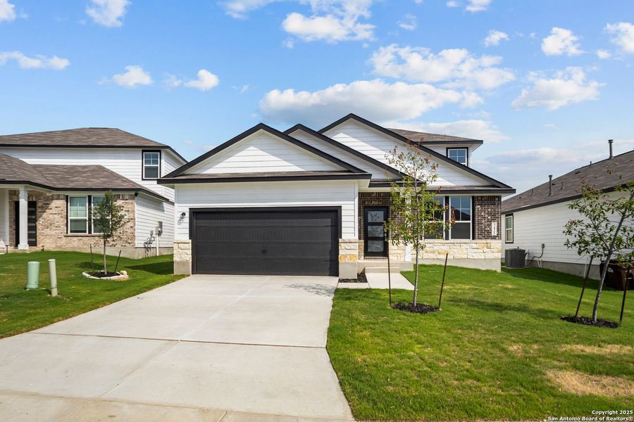 Front exterior of a new home in Horizon Pointe, Converse, TX, highlighting curb appeal (Image 65).