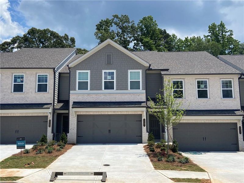 Front exterior of a new home in Eastlyn Crossing, Flowery Branch, GA, highlighting curb appeal (Image 19).