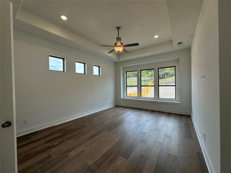 Primary Bedroom with elevated ceiling