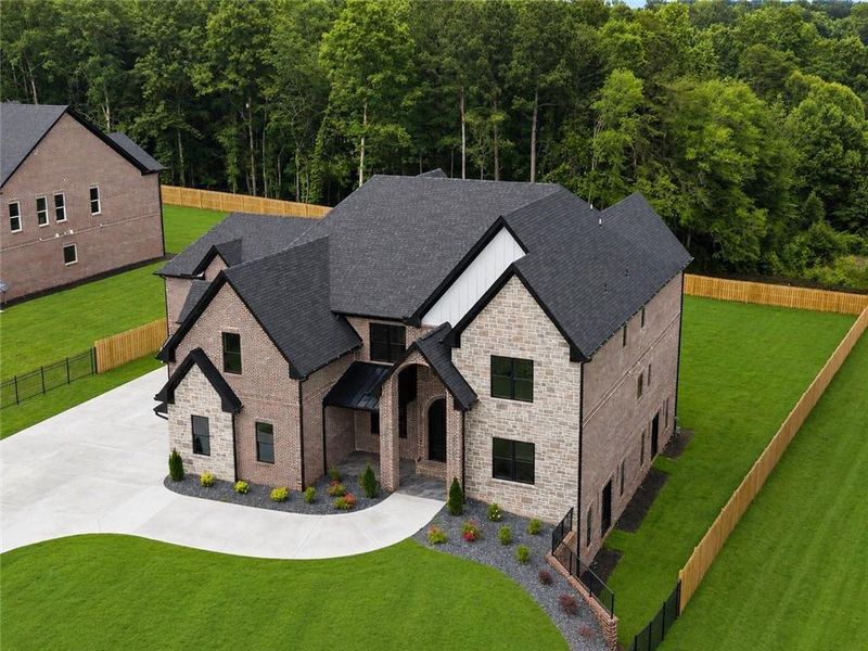 Front exterior of a new home in , Buford, GA, highlighting curb appeal (Image 33). Front exterior of a new home in , Buford, GA, highlighting curb appeal (Image 33).