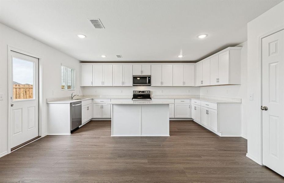 Kitchen featuring a large island ideal for informal dining and gatherings *Real home pictured Kitchen featuring a large island ideal for informal dining and gatherings *Real home pictured
