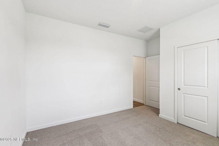 Spacious, unfurnished interior of a new home in Lakes at Bella Lago - Signature Series, Green Cove Springs (Image 20).