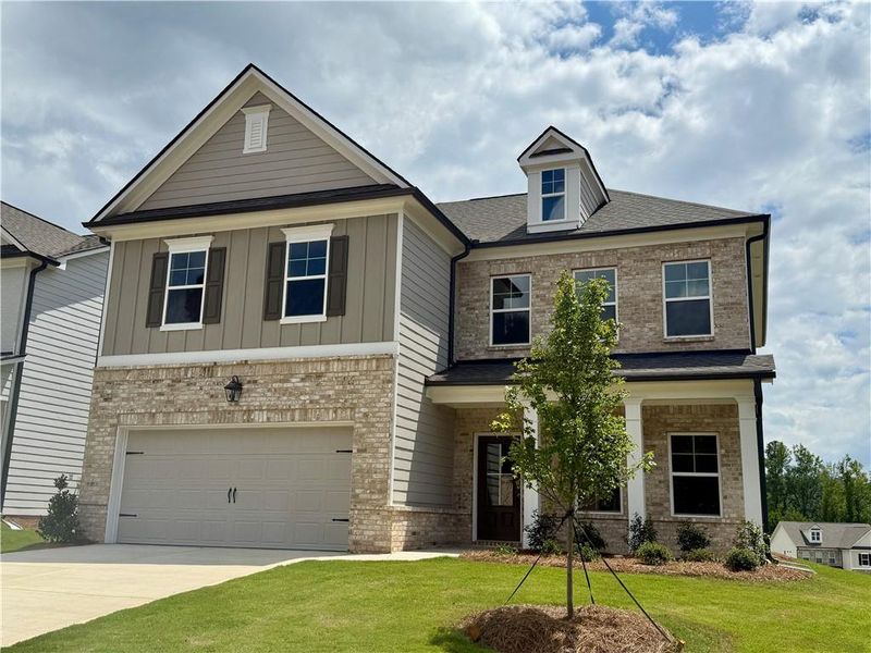 Front exterior of a new home in Ponderosa Farms Estates, Gainesville, GA, highlighting curb appeal (Image 14). Front exterior of a new home in Ponderosa Farms Estates, Gainesville, GA, highlighting curb appeal (Image 14).