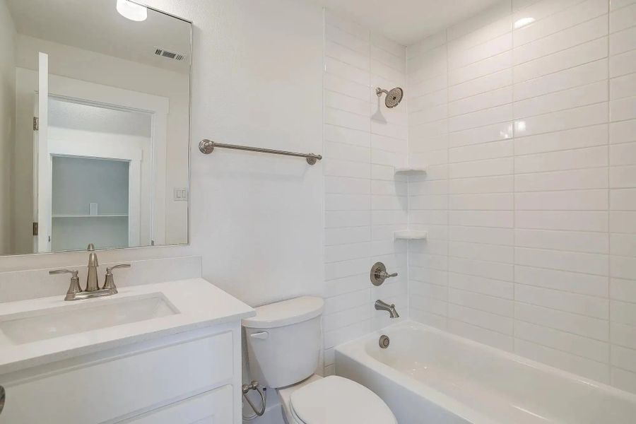 Representative furnished interior of a home built from the The Nathan by Elmwood Custom Homes in Ranch at Stone Hill, Waxahachie (Image 26).