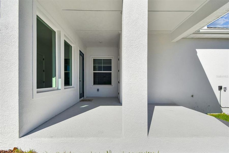Exterior details and patio area of a home in Emerald Landing at Waterside at Lakewood Ranch – Cottage Series, Sarasota (Image 2).