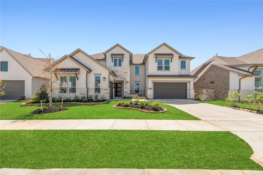 Front exterior of a new home in Bridgeland, Cypress, TX, highlighting curb appeal (Image 2).