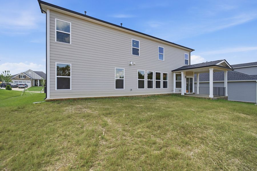 Exterior details and patio area of a home in Dorris Farm, White House (Image 4).