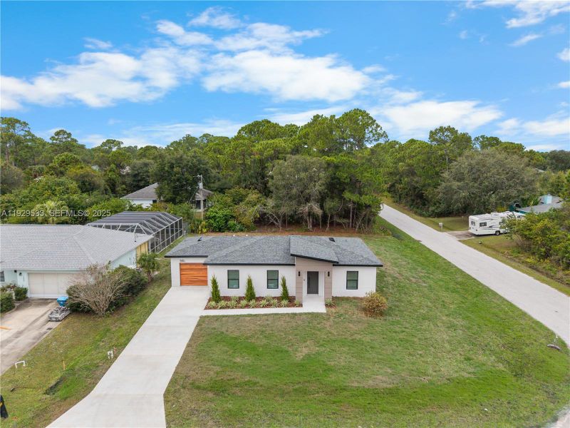 Front exterior of a new home in , Palm Bay, FL, highlighting curb appeal (Image 32). Front exterior of a new home in , Palm Bay, FL, highlighting curb appeal (Image 32).