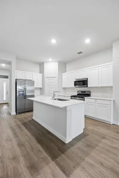 Kitchen in the Cedar home plan by Trophy Signature Homes – REPRESENTATIVE PHOTO
