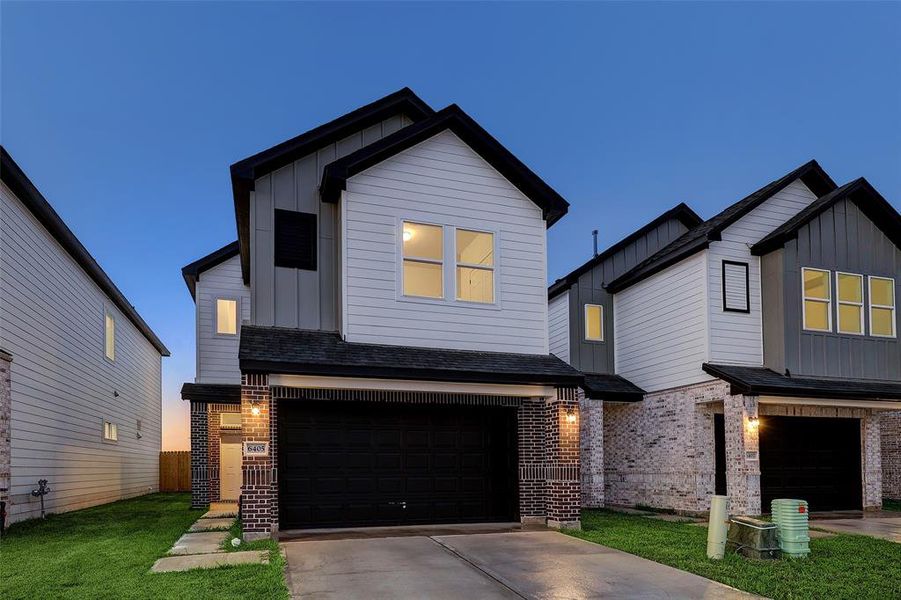 A perfect balance of tradition and contemporary design, this 2-story retreat blends classic brick crafstmanship with two-toned hardie siding for a unique finish.