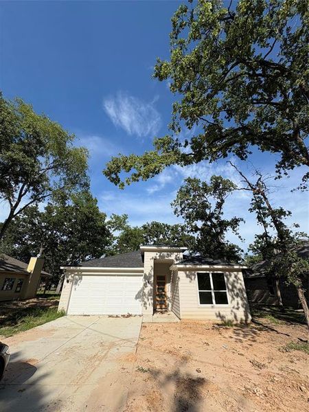 View of front facade with an attached garage and concrete driveway View of front facade with an attached garage and concrete driveway