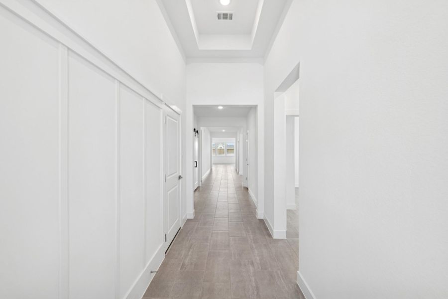 Welcoming foyer with decorative feature wall