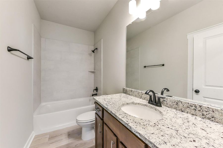 Furnished interior view inside a new home in Aldeana, Bonney (Image 12).