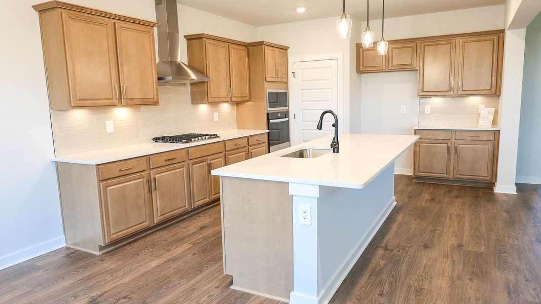 Representative furnished interior of a home built from the STONEBROOK II by D.R. Horton in Harvest Point, Spring Hill (Image 12).