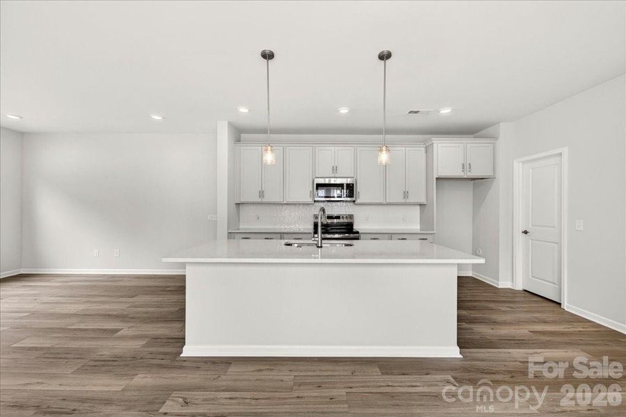 Chef-inspired kitchen with large island Chef-inspired kitchen with large island