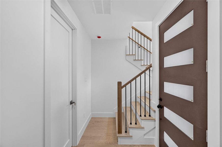 Entryway to unit A that opens to the stair case and the first bedroom