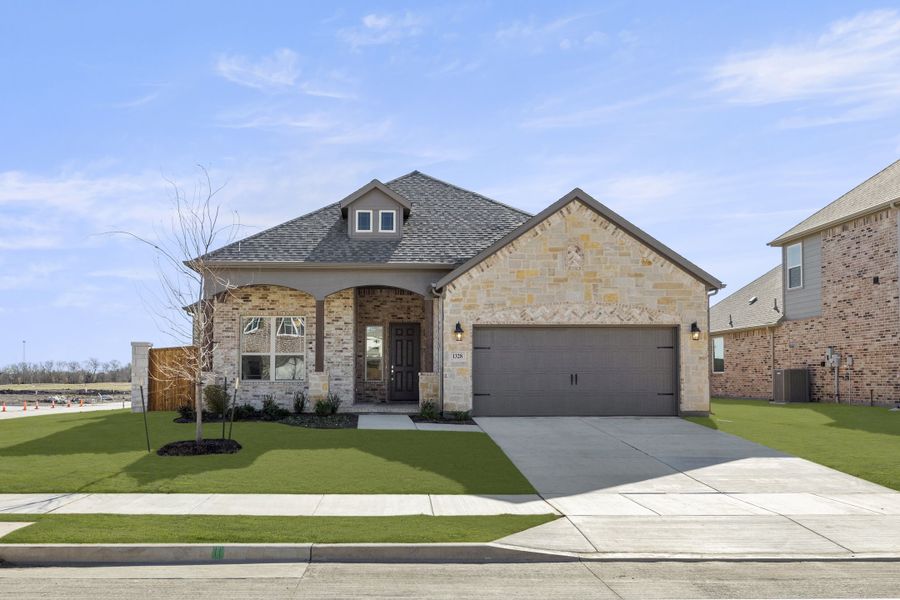 Front exterior of a new home in Anna Town Square, Anna, TX, highlighting curb appeal (Image 1). Front exterior of a new home in Anna Town Square, Anna, TX, highlighting curb appeal (Image 1).