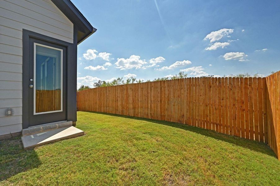 Exterior details and patio area of a home in Trinity Ranch, Elgin (Image 3).