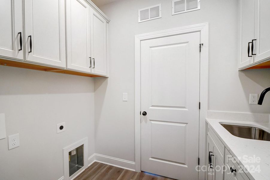 Laundry Room with Cabinets and Sink