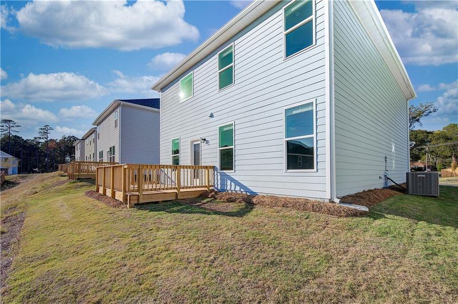 Exterior details and patio area of a home in Enclave at Evergreen, Fairburn (Image 3).
