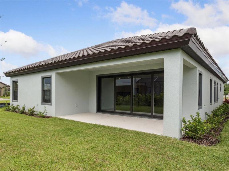 Front exterior of a new home in Crosswind Ranch, Parrish, FL, highlighting curb appeal (Image 1).