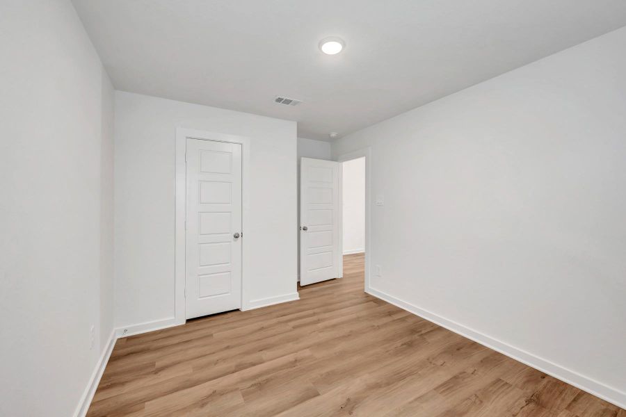 Spacious, unfurnished interior of a new home in Pinewood at Grand Texas, New Caney (Image 26).