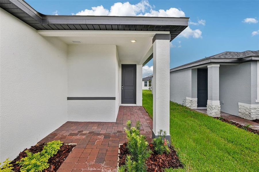 Exterior details and patio area of a home in Hamilton Bluff - Classic Series, Lake Hamilton (Image 19).