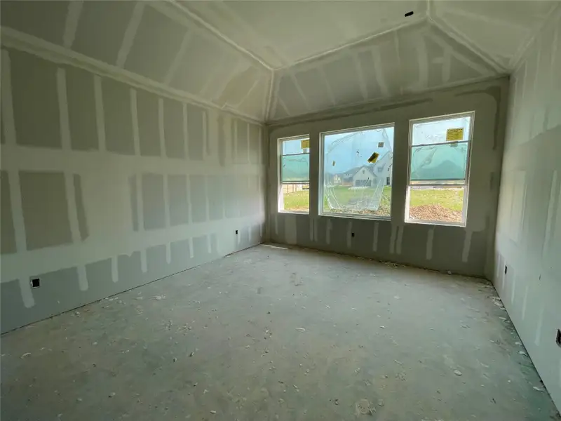 Primary Bedroom with elevated ceiling