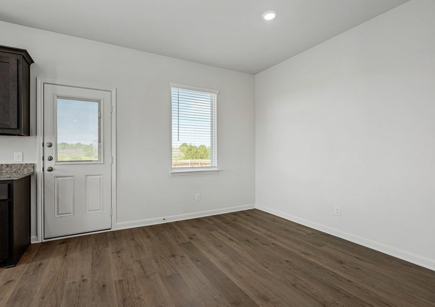 The dining room sits right off of the kitchen. The dining room sits right off of the kitchen.