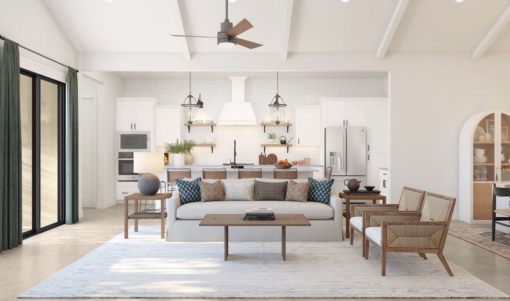 Great room with white-stained ceiling beams and ceiling fan