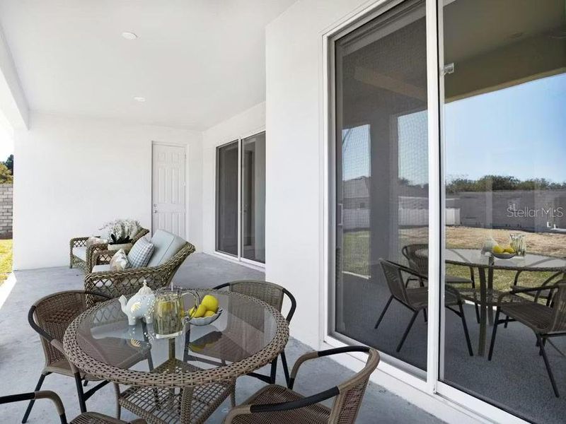 Exterior details and patio area of a home in The Lakes, Lake Alfred (Image 2).