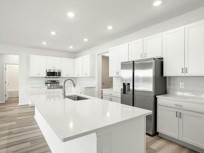 Your luxurious kitchen features quartz, 42-inch cabinets, Samsung SS appliances, and a walk-in pantry. Your luxurious kitchen features quartz, 42-inch cabinets, Samsung SS appliances, and a walk-in pantry.