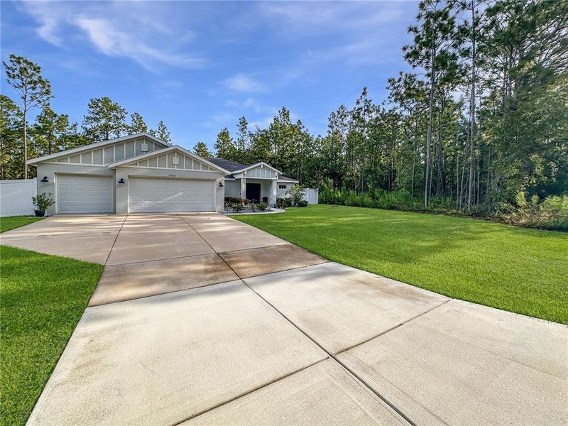 Front exterior of a new home in , Weeki Wachee, FL, highlighting curb appeal (Image 24).