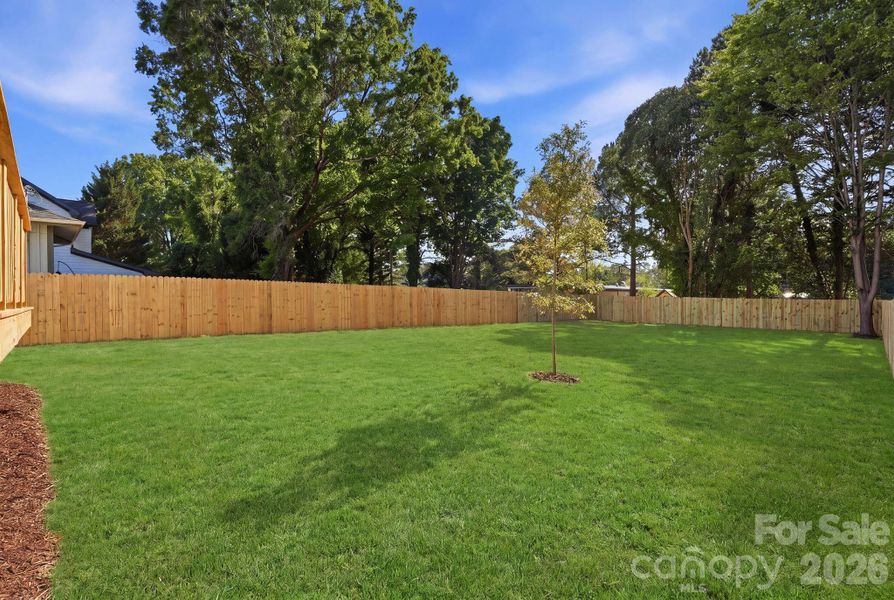 Backyard. Note: The lawn has been recently seeded, and photography has been digitally enhanced to represent the yard at full, established growth. Backyard. Note: The lawn has been recently seeded, and photography has been digitally enhanced to represent the yard at full, established growth.