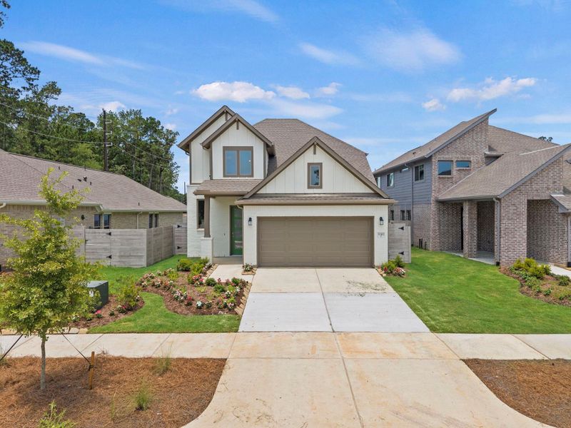Front exterior of a new home in Two Step Farm, Montgomery, TX, highlighting curb appeal (Image 1). Front exterior of a new home in Two Step Farm, Montgomery, TX, highlighting curb appeal (Image 1).