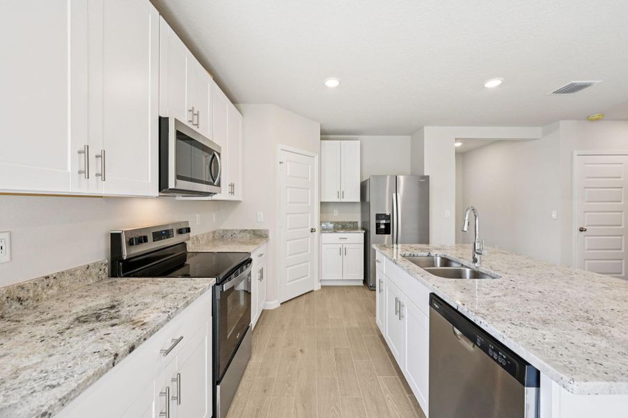 Furnished interior view inside a new home in Hampton Park - Classic Series, Vero Beach (Image 6). Furnished interior view inside a new home in Hampton Park - Classic Series, Vero Beach (Image 6).