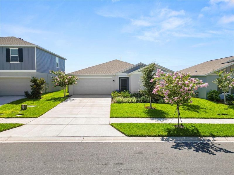 Front exterior of a new home in Hunt Club Groves, Lake Wales, FL, highlighting curb appeal (Image 24).
