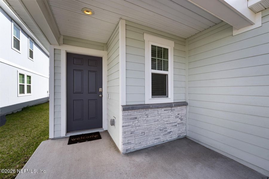 Exterior details and patio area of a home in Lakes at Bella Lago – Classic Series, Green Cove Springs (Image 4).