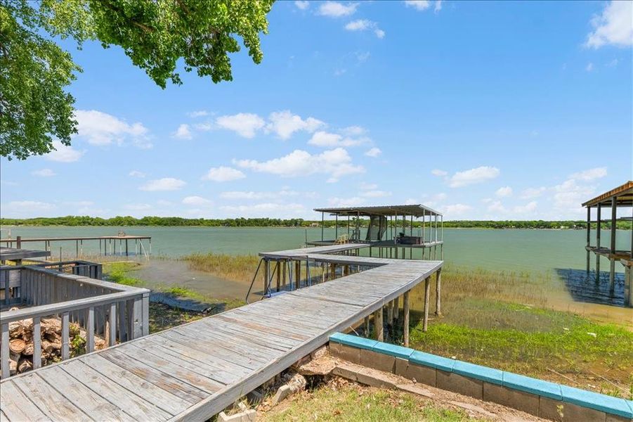 Dock area featuring a water view and boat lift