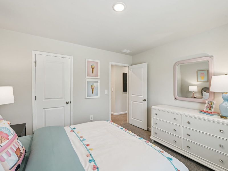 Secondary bedroom in the Chatham floorplan at a Meritage Homes community in Mebane, NC. Secondary bedroom in the Chatham floorplan at a Meritage Homes community in Mebane, NC.