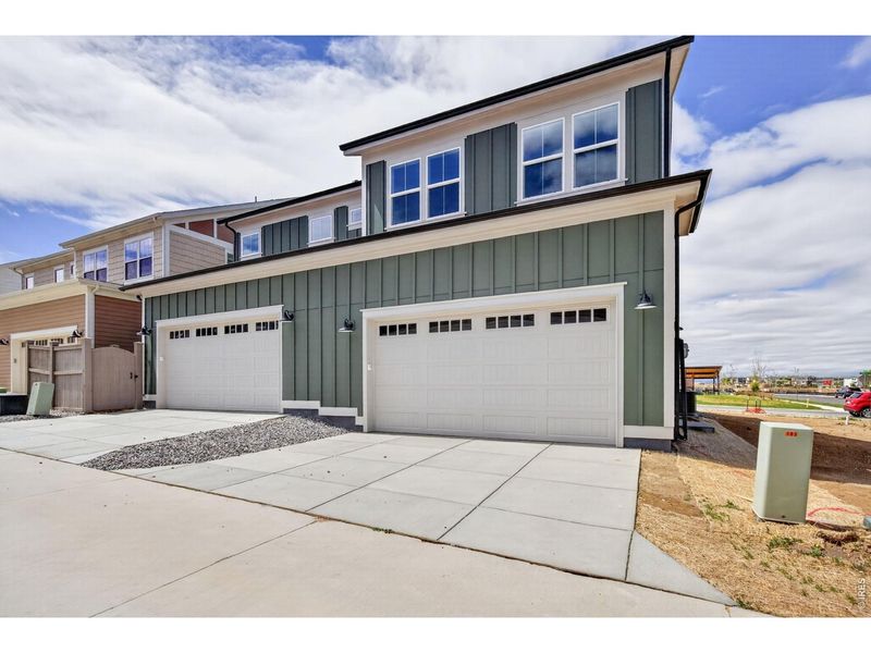 Front exterior of a new home in , Erie, CO, highlighting curb appeal (Image 14).
