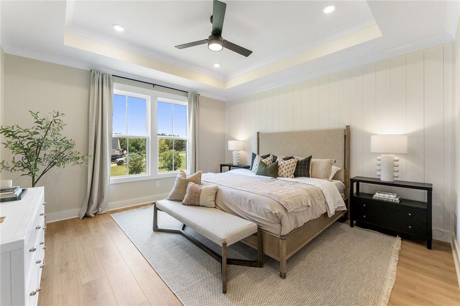 This primary bedroom offers ample natural light an